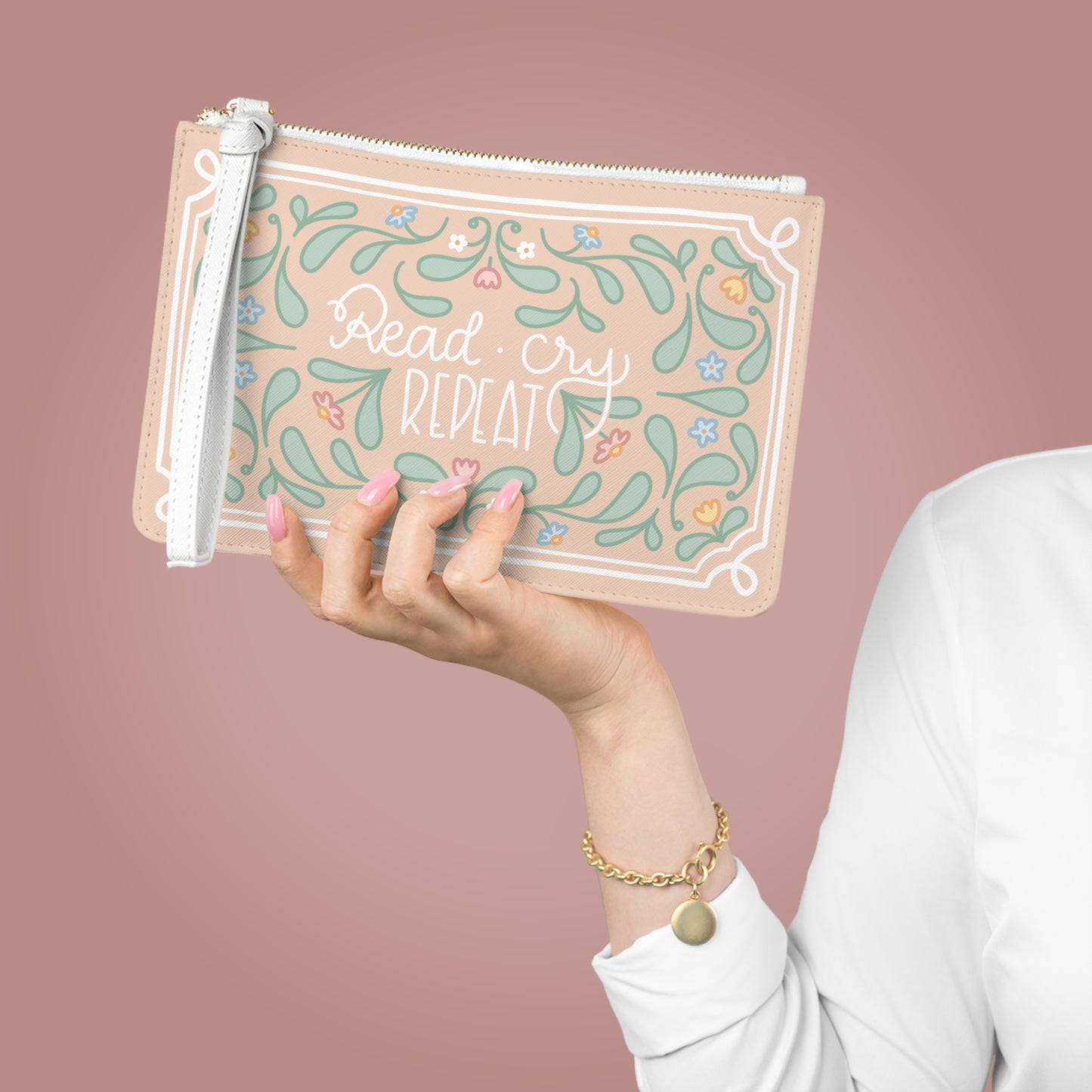 Read Cry Repeat clutch bag | floral folk art pattern