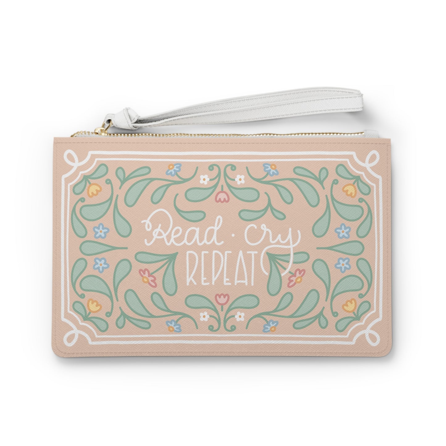 Read Cry Repeat clutch bag | floral folk art pattern